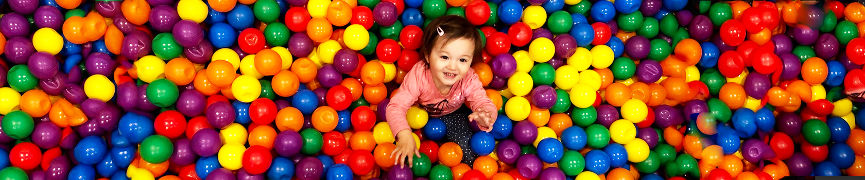 Young child in a ball pit- MoveAbout Therapy Services OT for Kids
